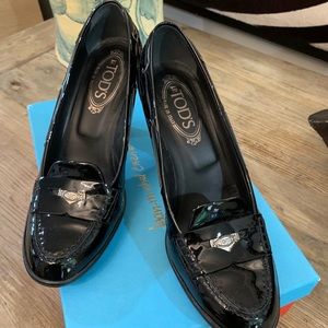 Tod’s black patent pumps